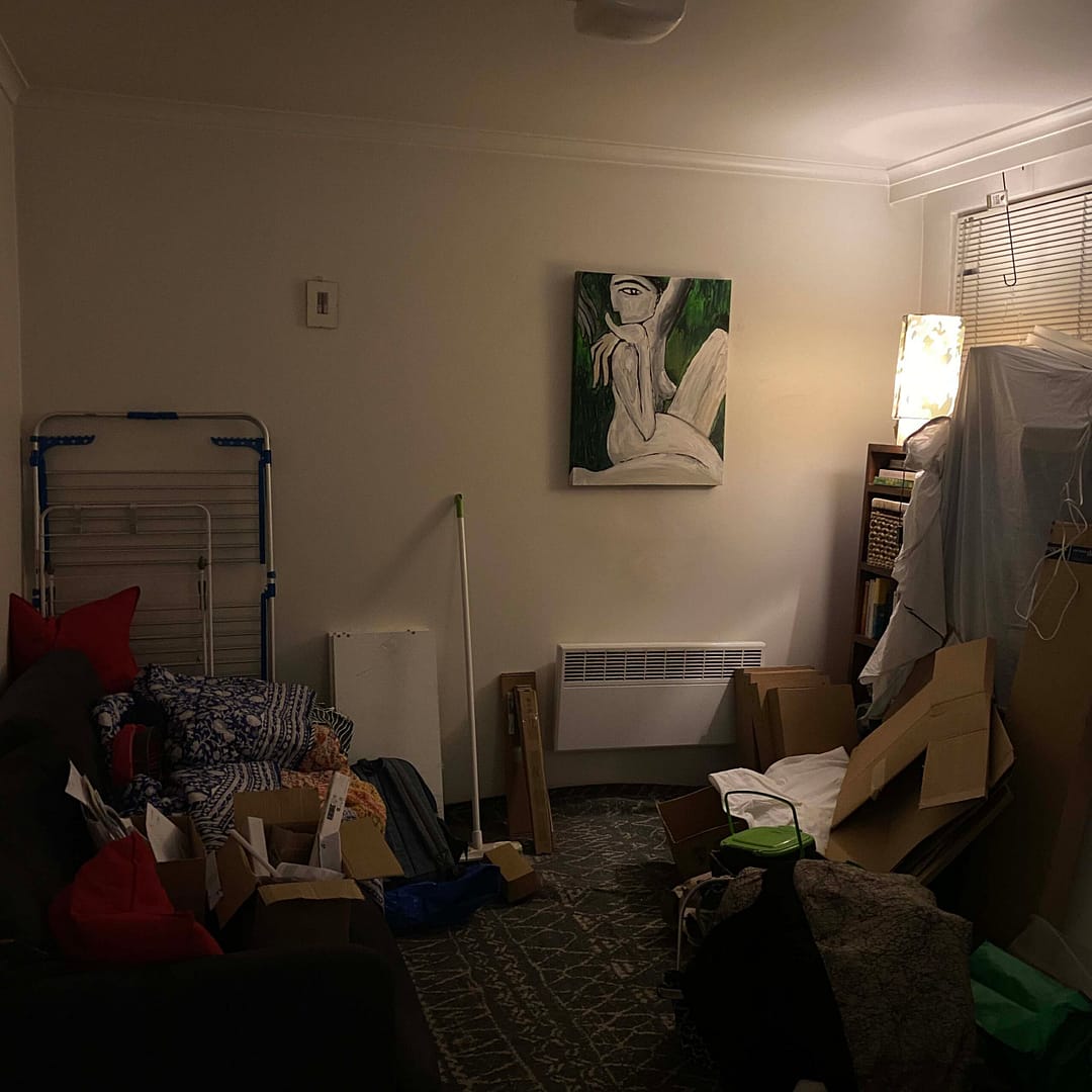 dimly lit living room western wall with crap nd corruption everywhere