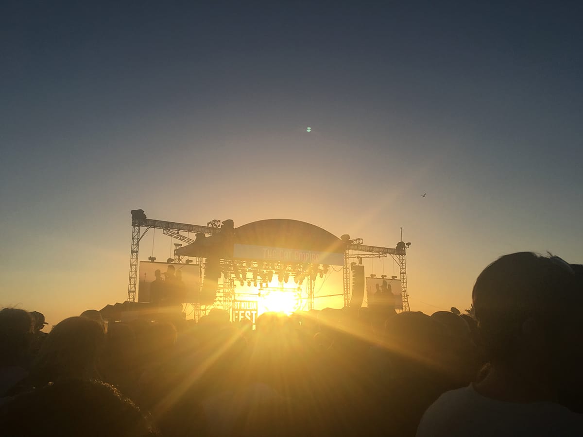 main stage with thousands of people at sunset at st kilda festival
