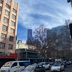 view to the city from a bourke street tram stop