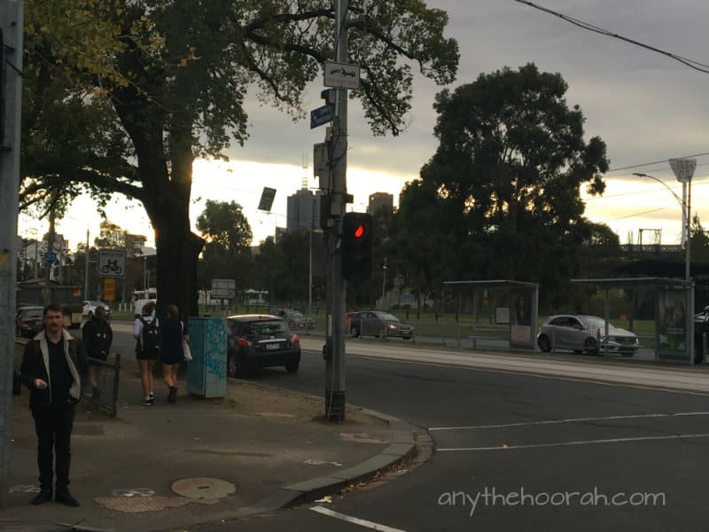 sunset and a man at the traffic lights