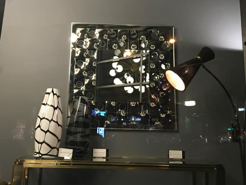 lights, light shades, mirror reflections at night in a retail shop on smith street in collingwood